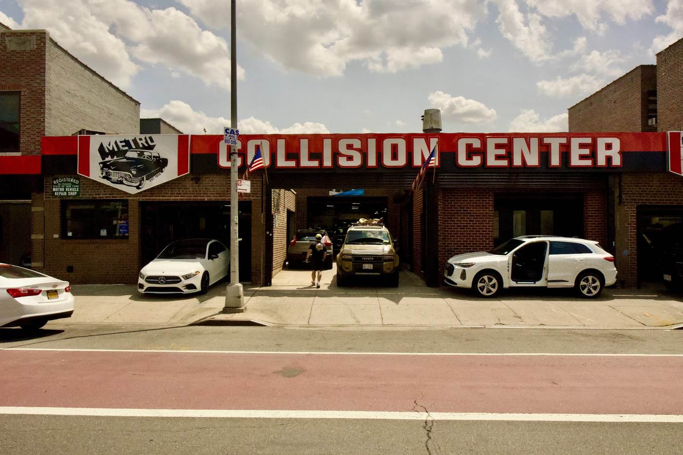 Vehicles awaiting repair inside Metro Auto Body